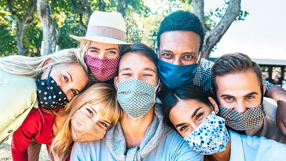 group of college students wearing face masks outdoors